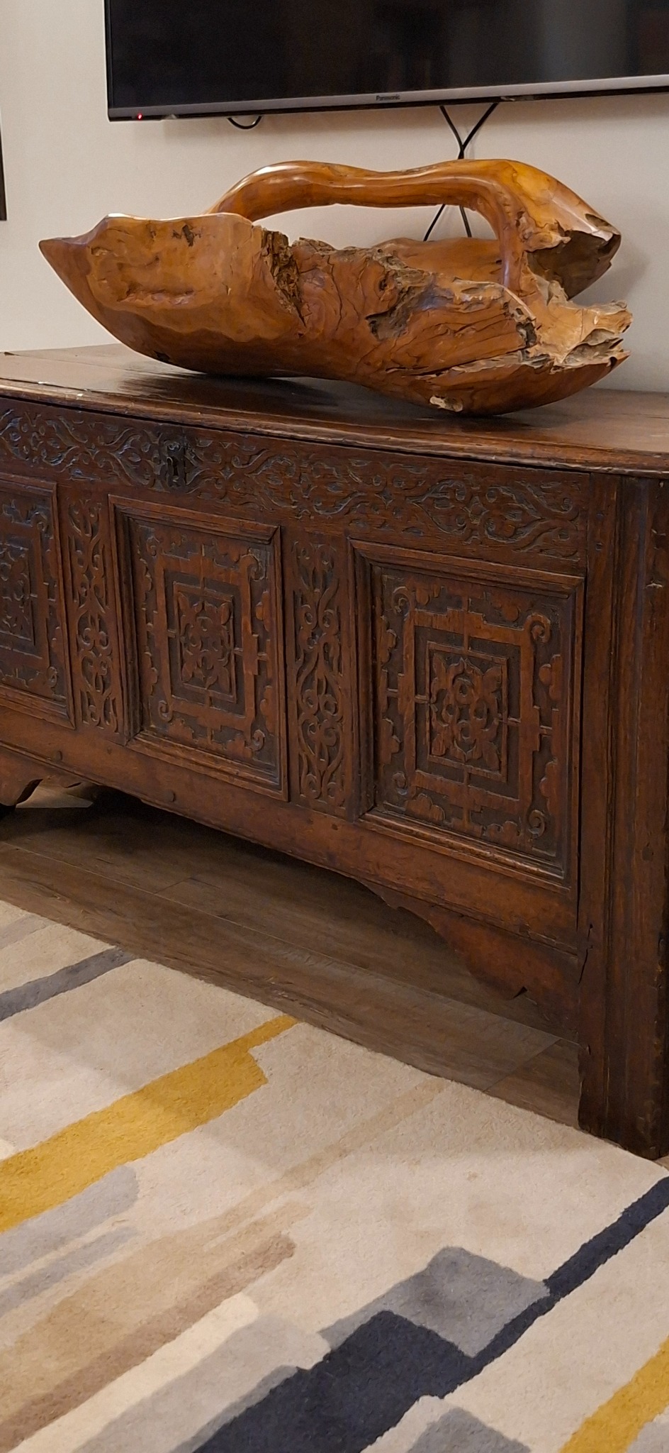 Carved antique chest and sculptural wooden bowl