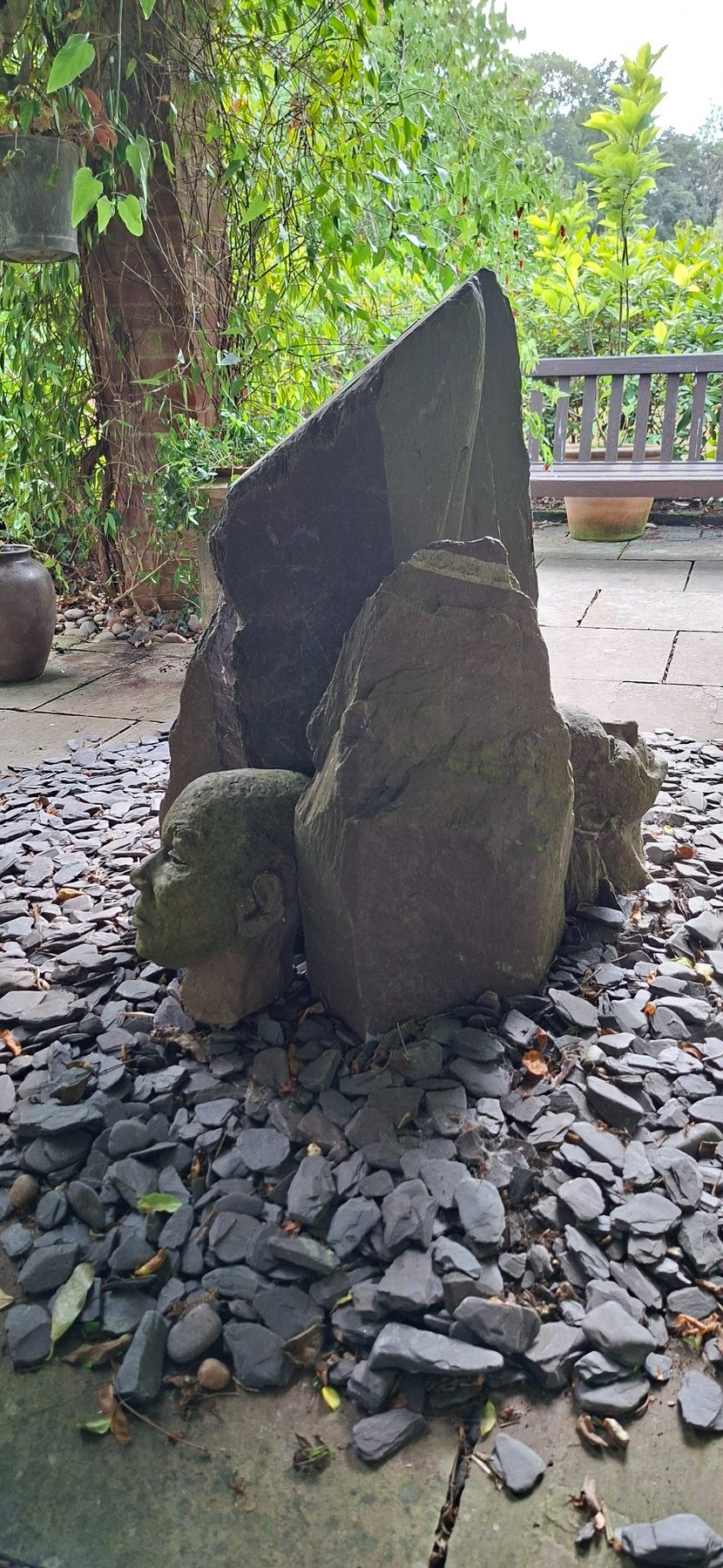 Stone head sculpture in the garden